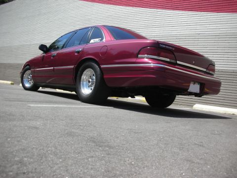 1992 Ford Crown Victoria - Maroon 1992 Ford Crown Victoria with drag slicks on rear wheels.