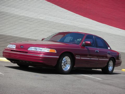 1992 Ford Crown Victoria - This maroon 1992 Ford Crown Victoria features chrome wheels and a distinctive body style.