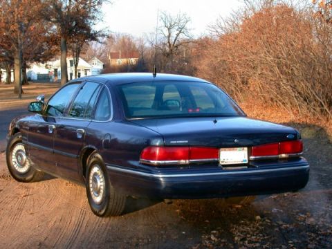 1995 Ford Crown Victoria - The rear view of a 1995 Ford Crown Victoria shows its taillights and license plate.
