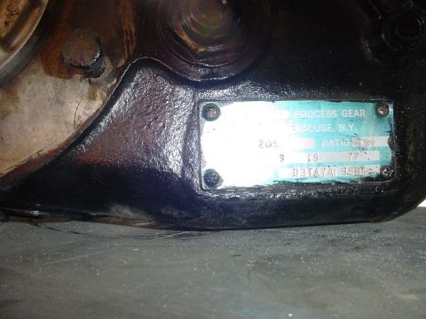 1984 Ford Bronco - A close-up view of a transfer case data plate with manufacturing information and gear ratio details.