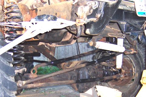 1978 Ford Bronco - Undercarriage view of suspension and steering parts, likely from a 4x4 vehicle.
