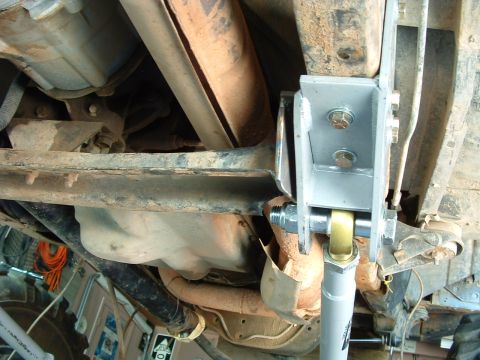 1993 Ford Bronco - The underside of a vehicle reveals its suspension system and exhaust components, with a "Supermotors.net" watermark visible.