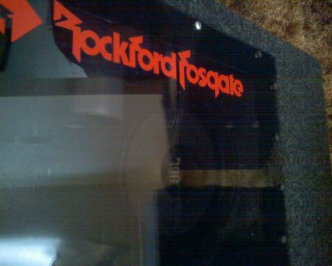 1901 Honda Odyssey - A close-up view of a Rockford Fosgate logo on a speaker enclosure.