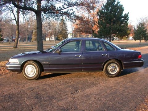 1995 Ford Crown Victoria - A 1995 Ford Crown Victoria sedan is shown from the side in this registry photo.