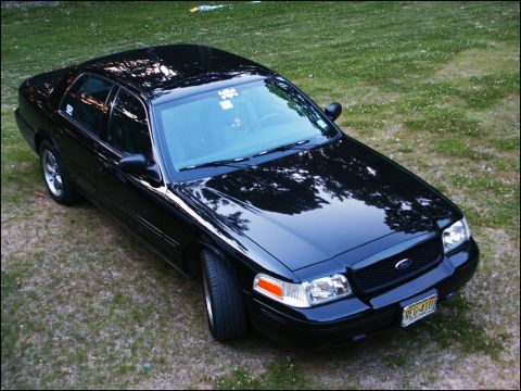 2001 Mercury Grand Marquis - Black 2001 Mercury Grand Marquis parked on a grassy area.