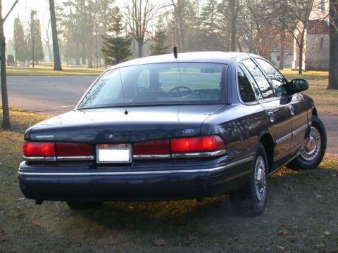 1995 Ford Crown Victoria - Rear view of a 1995 Ford Crown Victoria sedan parked outdoors.