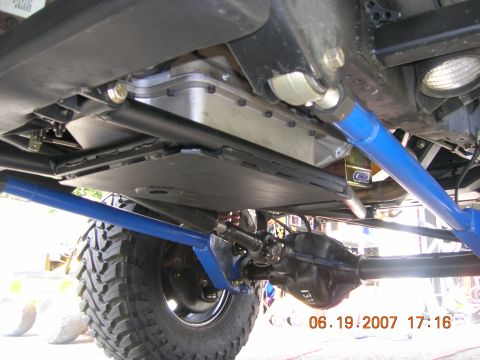 1996 Ford Bronco - Close-up of the undercarriage, highlighting the suspension and drivetrain components of a modified vehicle.