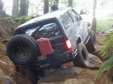 1994 Ford Explorer - A lifted Ford Bronco navigates a rocky trail, demonstrating its off-road capabilities.