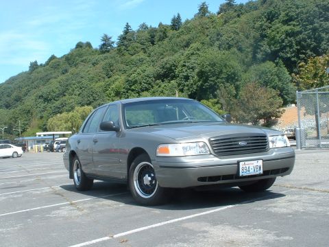 2000 Ford Crown Victoria - This 2000 Ford Crown Victoria is seen from a three-quarter front view in a parking lot.