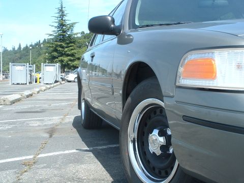 2000 Ford Crown Victoria - Side view of a 2000 Ford Crown Victoria parked in a lot.