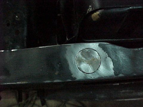 1967 Mercury Cougar - Filling a 3/4" hole in the radiator core support - the previous owner had an alarm system installed.........