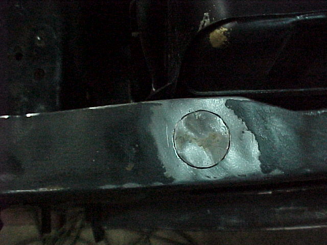 Filling a 3/4" hole in the radiator core support - the previous owner had an alarm system installed.........