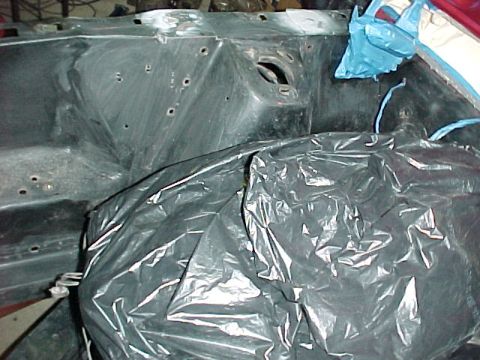 1967 Mercury Cougar - The engine bay is covered with black and blue plastic sheeting, obscuring most of the components.