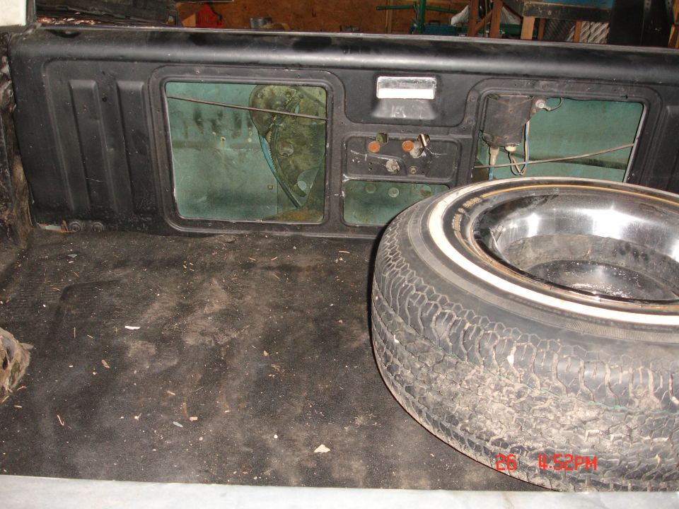 Spare tire with whitewall in the cargo area of a 1985 Chevrolet Blazer