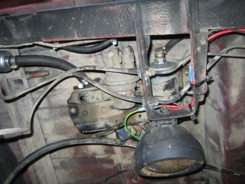 1987 Suzuki Samurai - Engine bay shows fuel pump, filter, and wiring, but no clear vehicle identification.