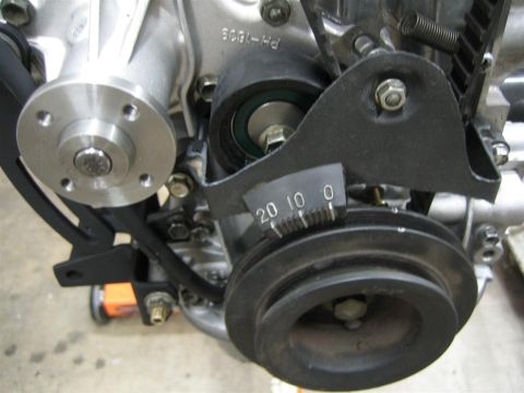 1987 Suzuki Samurai - Close-up of an engine component, likely a timing belt tensioner adjustment bracket.