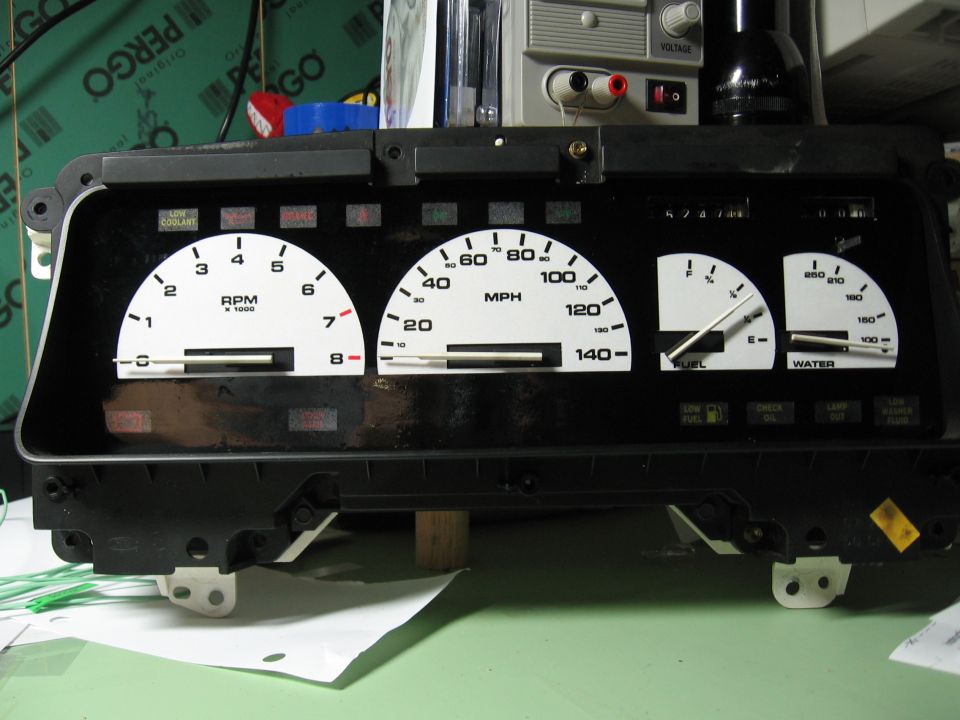 Car dashboard with tachometer, speedometer, fuel, and water gauges. Odometer shows 52478