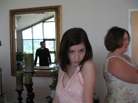 1988 Ford Bronco - A wedding scene features a young woman in a pink dress, an older woman, and a man reflected in a mirror.
