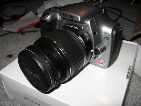 1997 Ford Probe - A silver Canon EOS Rebel camera with a lens is shown on a white box.