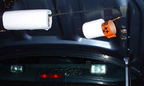 The ever present paper towels and toilet paper (The Biohazard tape is for afterwards!)The strobe on the right lights up when the trunk is opened.