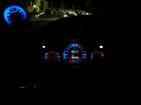 2001 Mercury Grand Marquis - The illuminated dashboard gauges display mileage and other indicators at night.