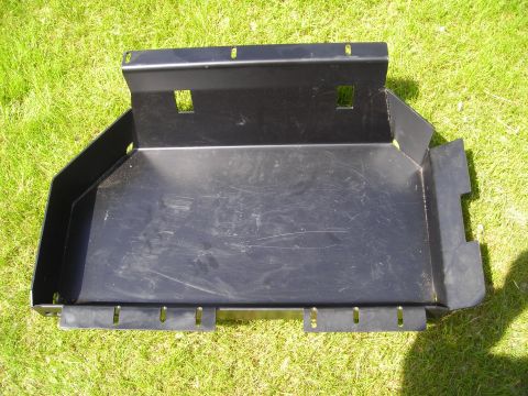 2003 Jeep TJ - A black metal skid plate is shown outdoors on a grassy surface.