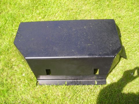 2003 Jeep TJ - A black metal skid plate is shown from a three-quarter front angle on a grassy surface.