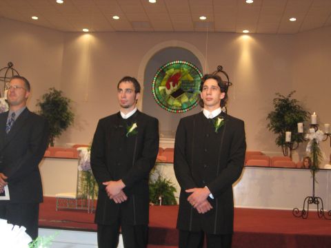1988 Ford Bronco - Three men in formal attire stand in a church, likely for a wedding ceremony.