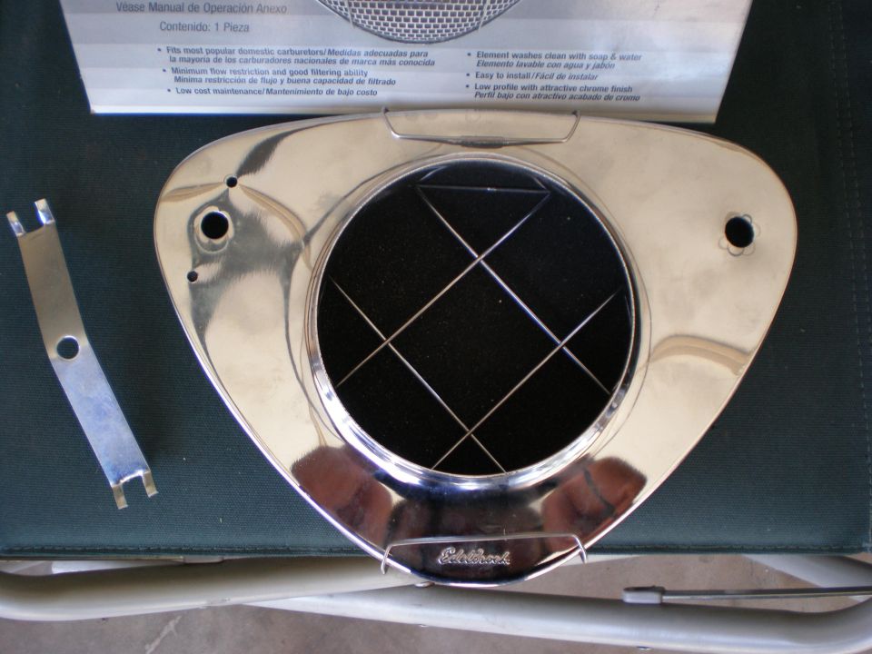 Edelbrock chrome air cleaner assembly with black filter and metal bracket