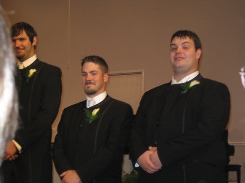 1988 Ford Bronco - Three men in formal wear stand side-by-side, possibly at a wedding or formal event.
