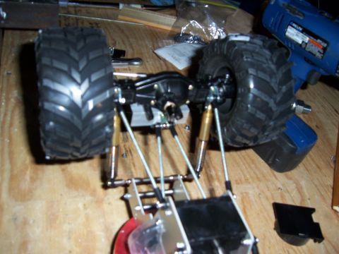1996 Ford Bronco - Close-up of an RC car chassis, showing suspension and large tires.