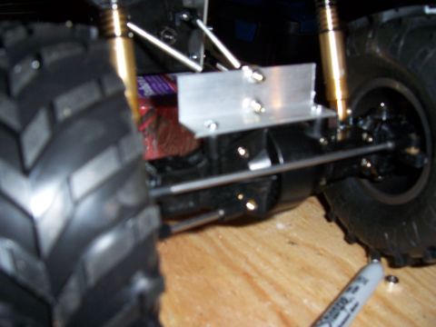 1996 Ford Bronco - RC car suspension components and a large off-road tire are visible in this close-up shot.