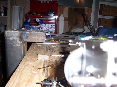 1996 Ford Bronco - A cluttered workbench displays metal components and various tools, including a red toolbox.
