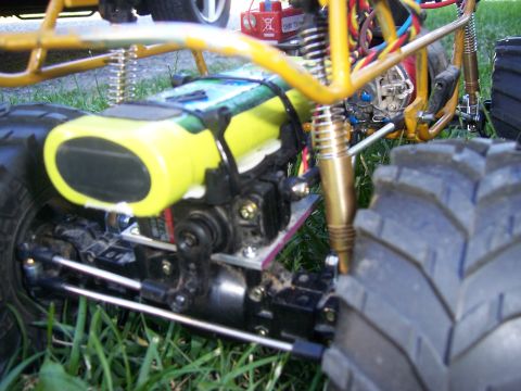 1996 Ford Bronco - Close-up view of a remote control car's chassis, suspension, and large tire.