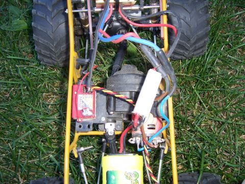 1996 Ford Bronco - Close-up of a remote control car's chassis, showing its internal components and wiring.