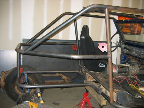 1992 Ford Mustang - This custom buggy build, likely a 1974 Ford Bronco, features a prominent roll cage and racing seat.