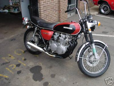 1985 Ford Crown Victoria LTD - Motorcycle with 'HONDA' visible on the tank.