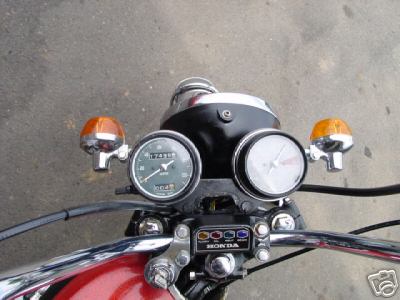 1985 Ford Crown Victoria LTD - Close-up of a motorcycle's dashboard, showing instruments and controls.