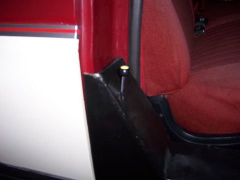 1991 Ford Bronco - Interior view of a 1991 Ford Bronco, focusing on the seat and door panel details.
