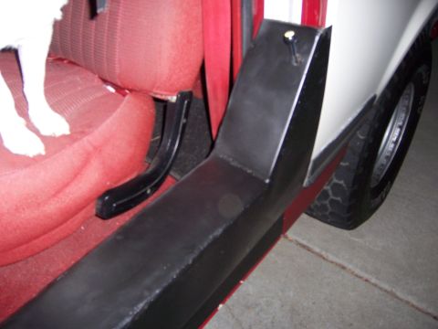 1991 Ford Bronco - Interior view of a vehicle's passenger side, showing red upholstery and black trim.