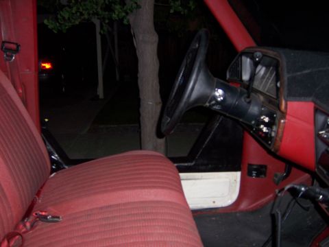 1991 Ford Bronco - Interior view of a 1991 Ford Bronco, highlighting the red seats and dashboard details.