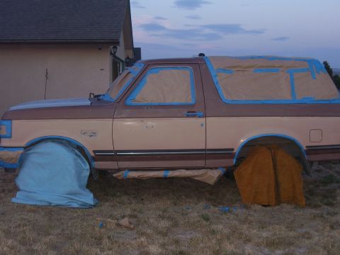 1990 Ford Bronco - This Ford Bronco is taped up and covered, likely in preparation for a new paint job.