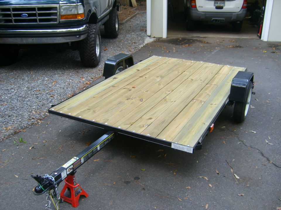 Dark green 1992-1997 Ford F-250/F-350 front view with a trailer