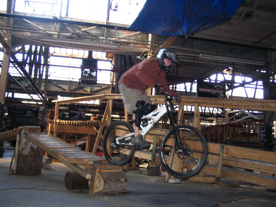 Mountain bike on a wooden ramp inside a building