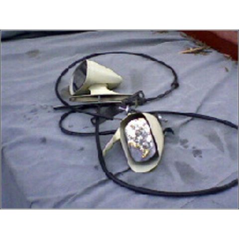 1972 Ford Ranchero - A pair of beige side mirrors with black wiring are laid out on a gray tarp, possibly for a vintage vehicle.