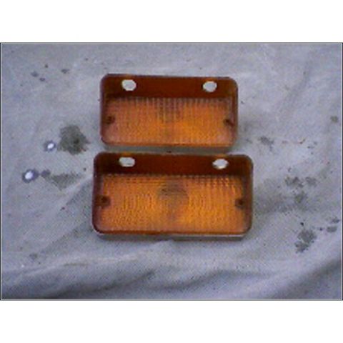 1972 Ford Ranchero - Two amber marker lights are shown on a gray, textured surface.