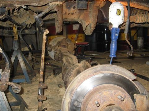 1988 Ford Bronco - sway bar disconnected axle laying on the floor drive shaft hanging out old i-beam brackets removed, not as bad as i thought it would be