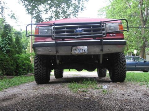 1988 Ford Bronco - mangled brush guard from jc whitney...the lights are still in so i have no worries!