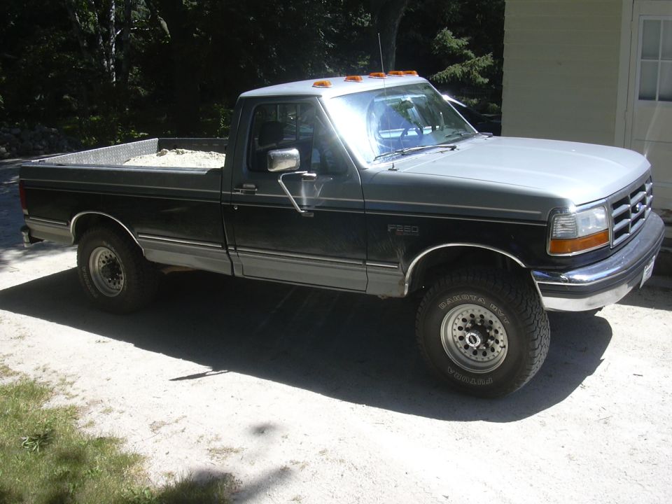 Two-tone gray and black 1992 Ford F-250 pickup truck with a silver roof, parked outdoors