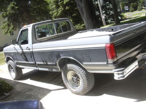 1992 Ford F-250 - This 1992 Ford F-250 pickup truck is shown from the rear three-quarter angle.